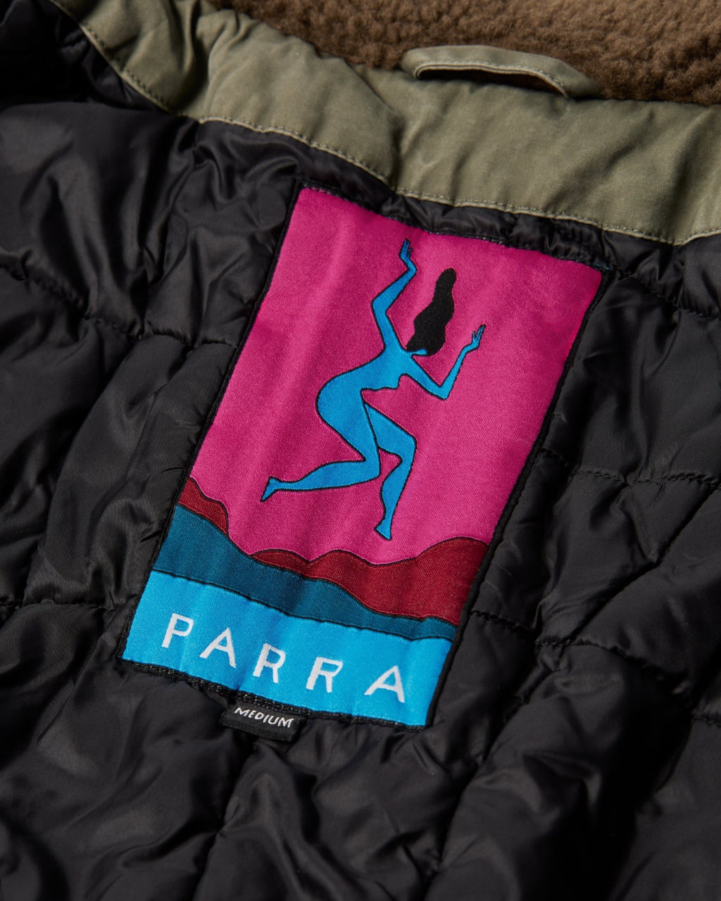 by Parra Darwin Takes Flight Jacket - Green, close-up of the Parra label on the quilted lining