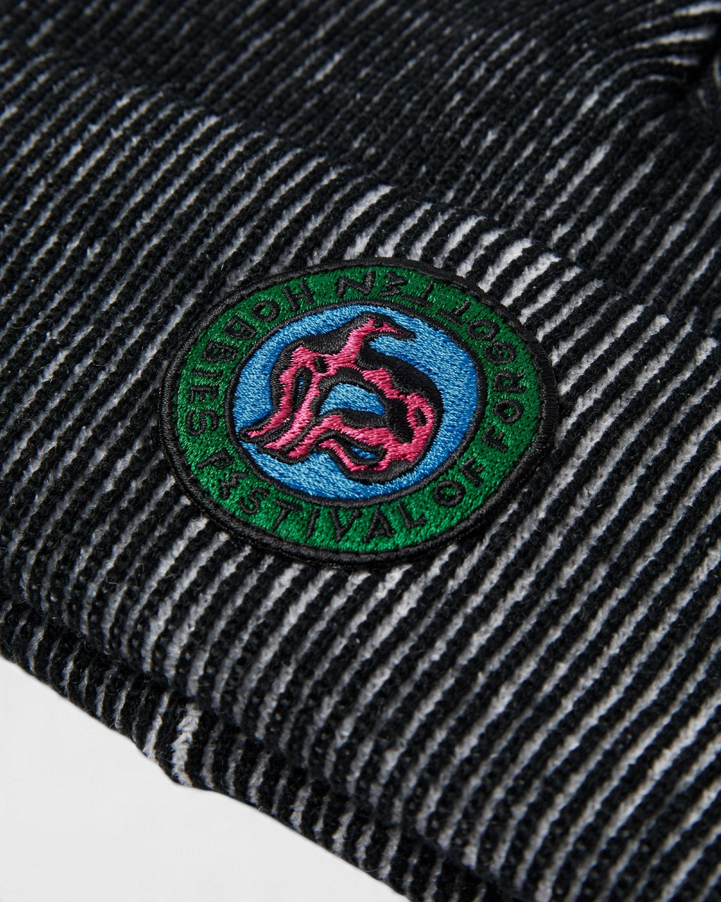 by Parra Forgotten Hobbies Beanie - Black, close-up of the Forgotten Hobbies patch