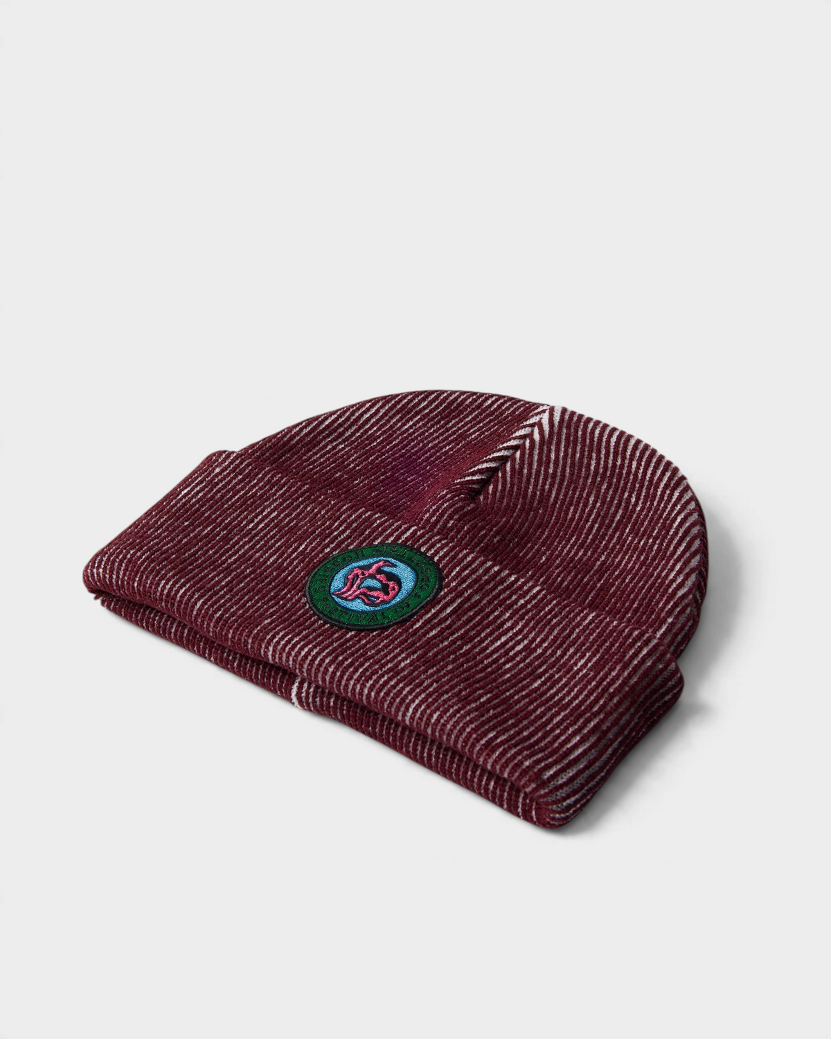 by Parra Forgotten Hobbies Beanie - Dark Red, angled view lying flat