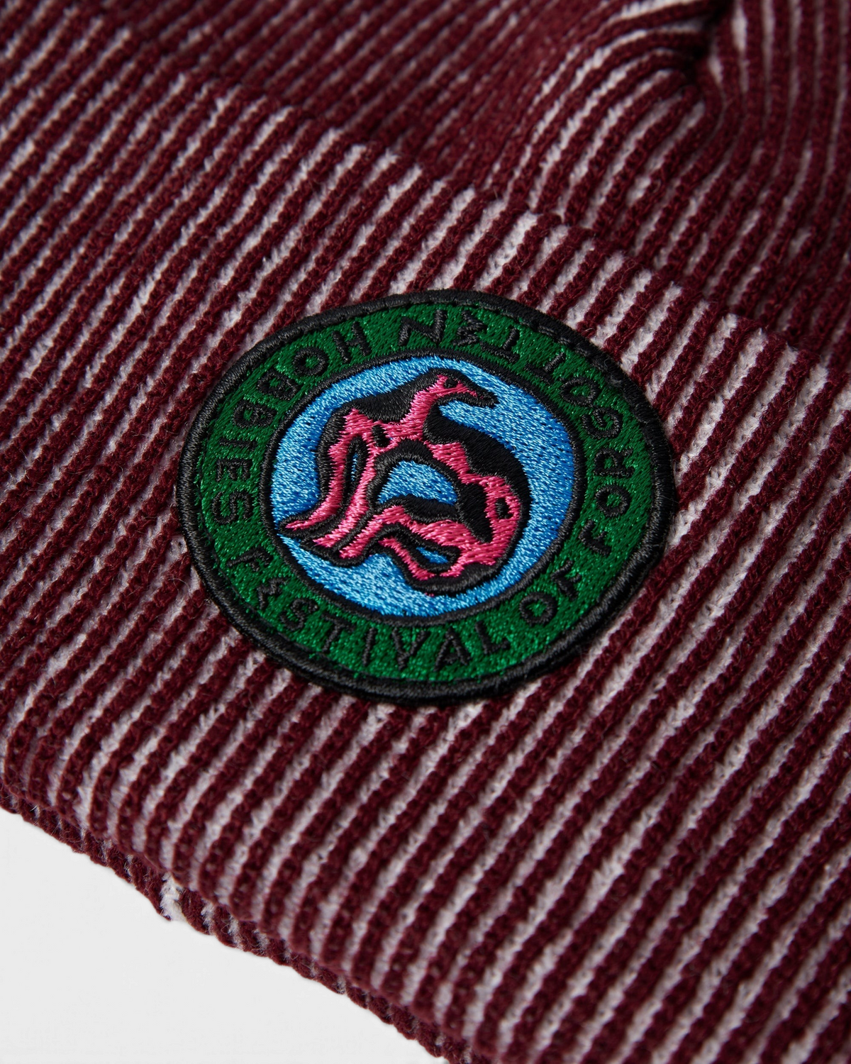 by Parra Forgotten Hobbies Beanie - Dark Red, close-up of the Forgotten Hobbies patch