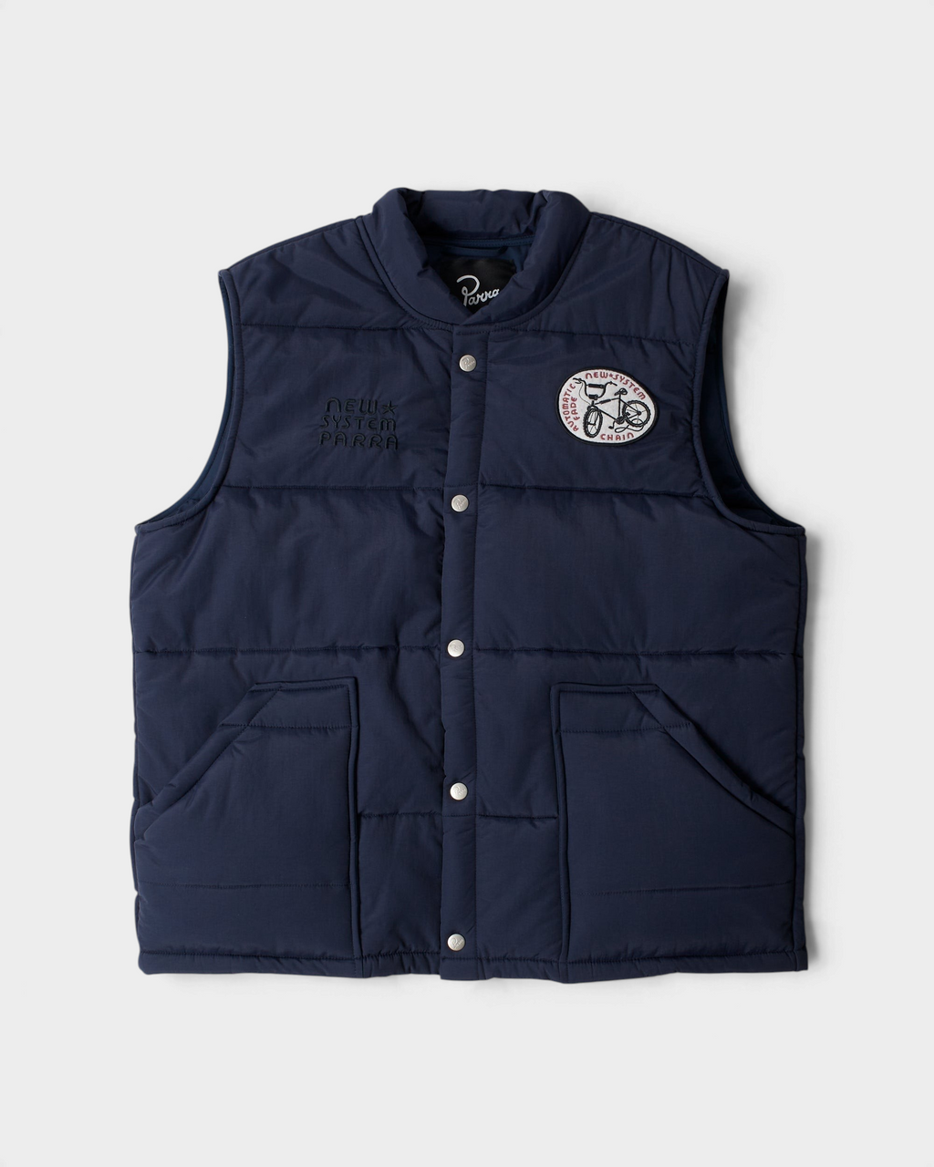 by Parra New System Puffer Vest - Navy Blue, front flat-lay with snap buttons, chest embroideries and two front pockets