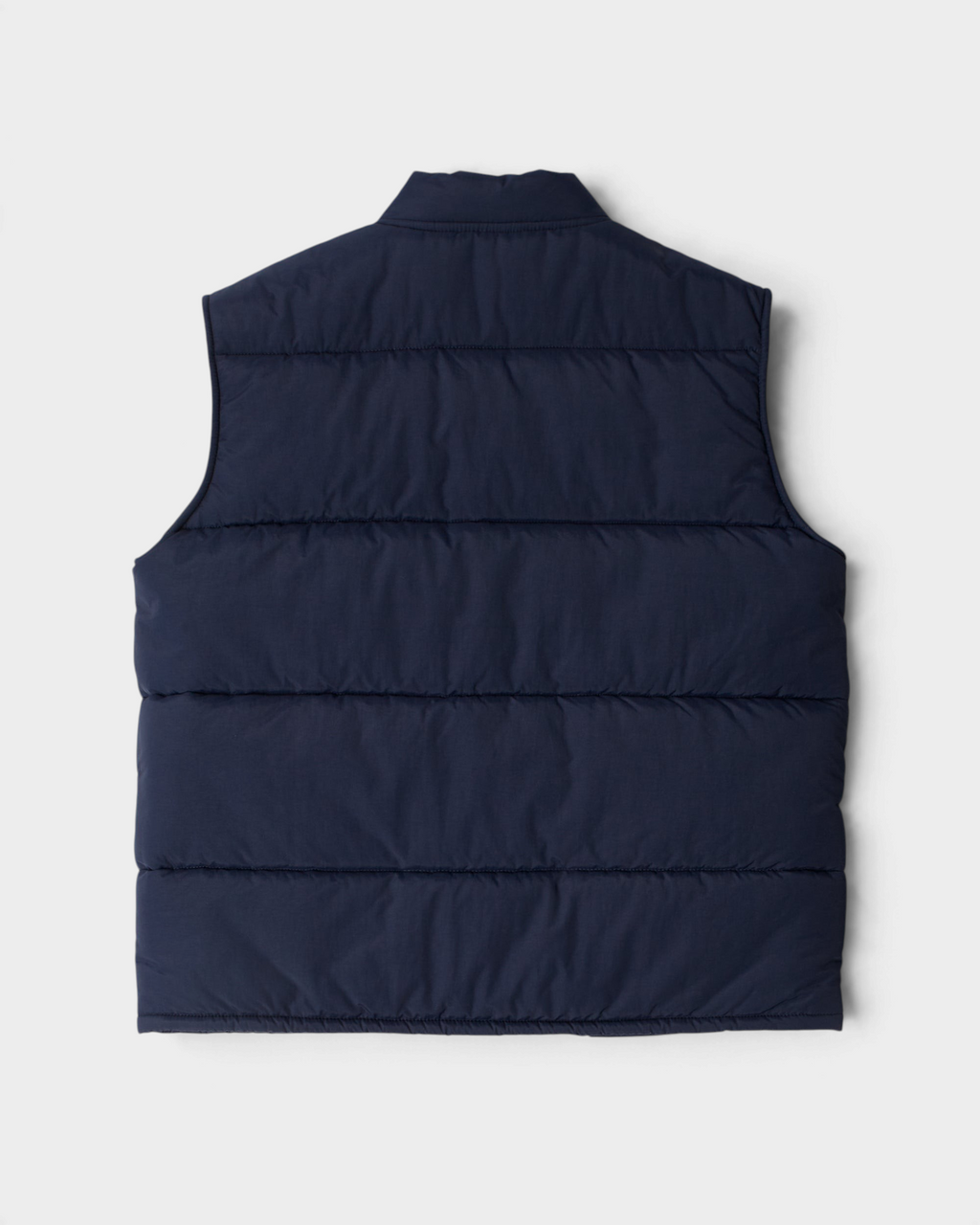 by Parra New System Puffer Vest - Navy Blue, back flat-lay showing the quilted panels