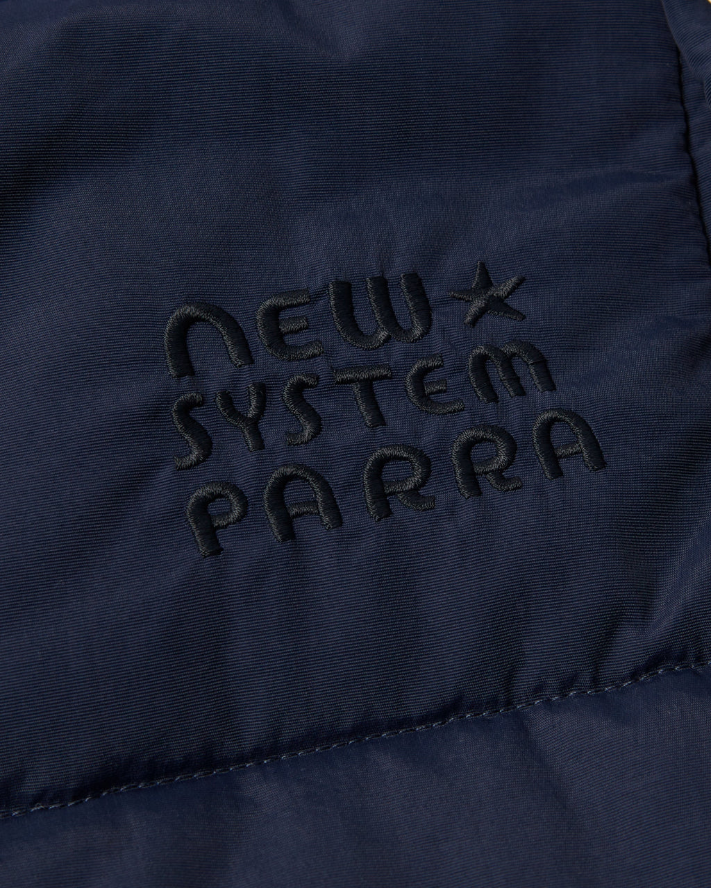 by Parra New System Puffer Vest - Navy Blue, close-up of the New System Parra chest embroidery