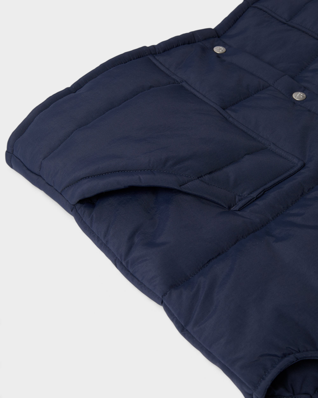 by Parra New System Puffer Vest - Navy Blue, close-up of a front pocket