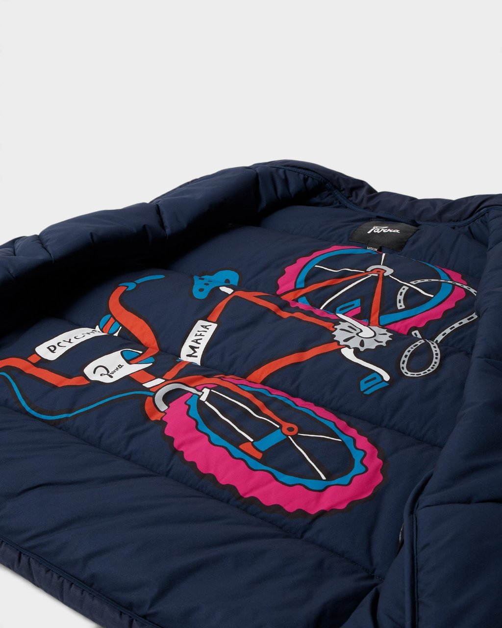 by Parra New System Puffer Vest - Navy Blue, opened up, showing the bicycle print on the lining