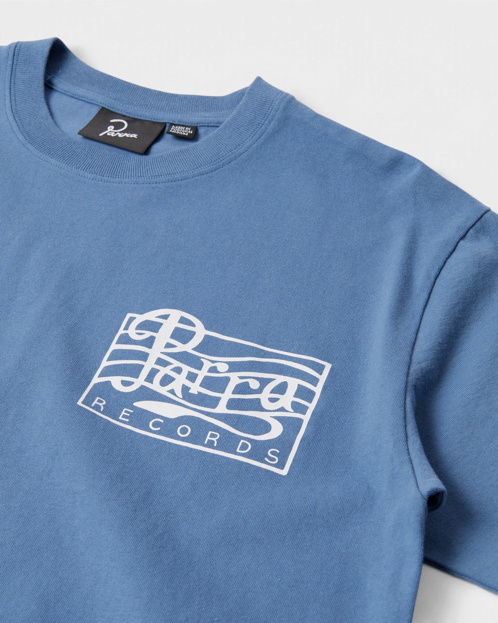 by Parra Parra Records T-Shirt - Blue, close-up of the chest print and the Parra neck label