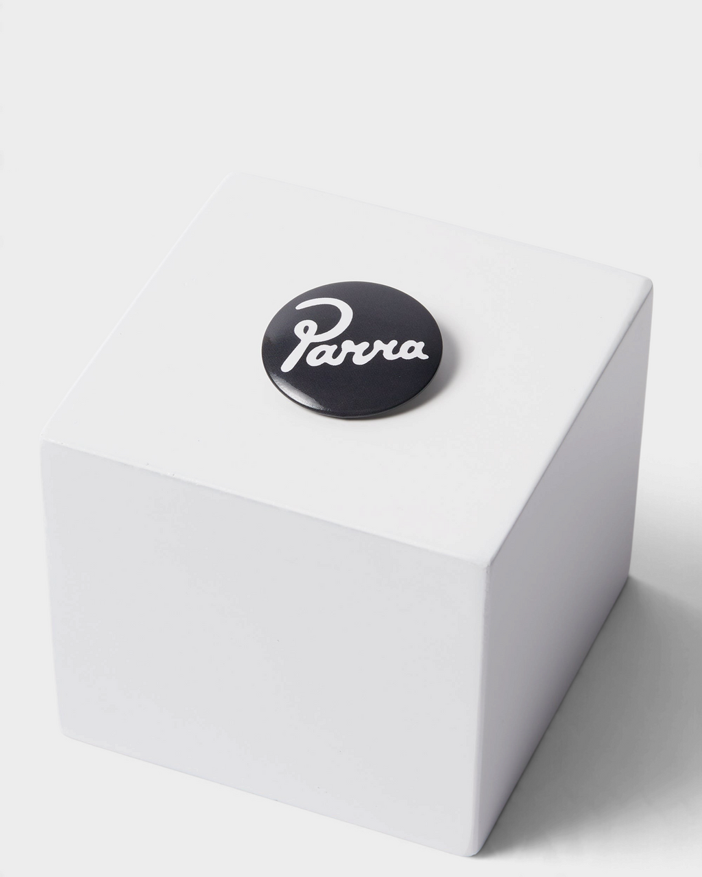 by Parra Some Butonis Pin-Back Set - Pink, close-up of the black Parra script button
