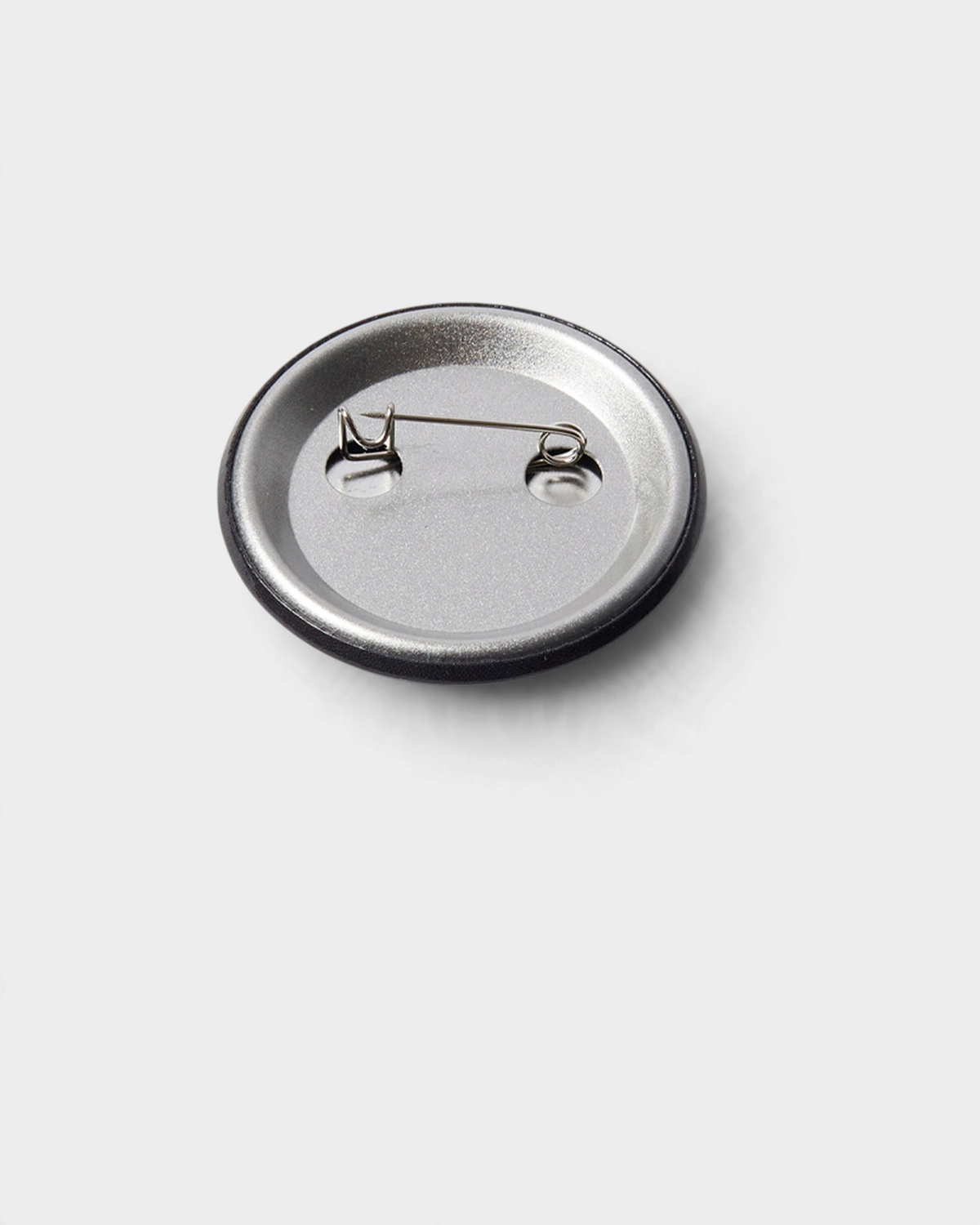 by Parra Some Butonis Pin-Back Set - Pink, the back of a button, showing the safety pin