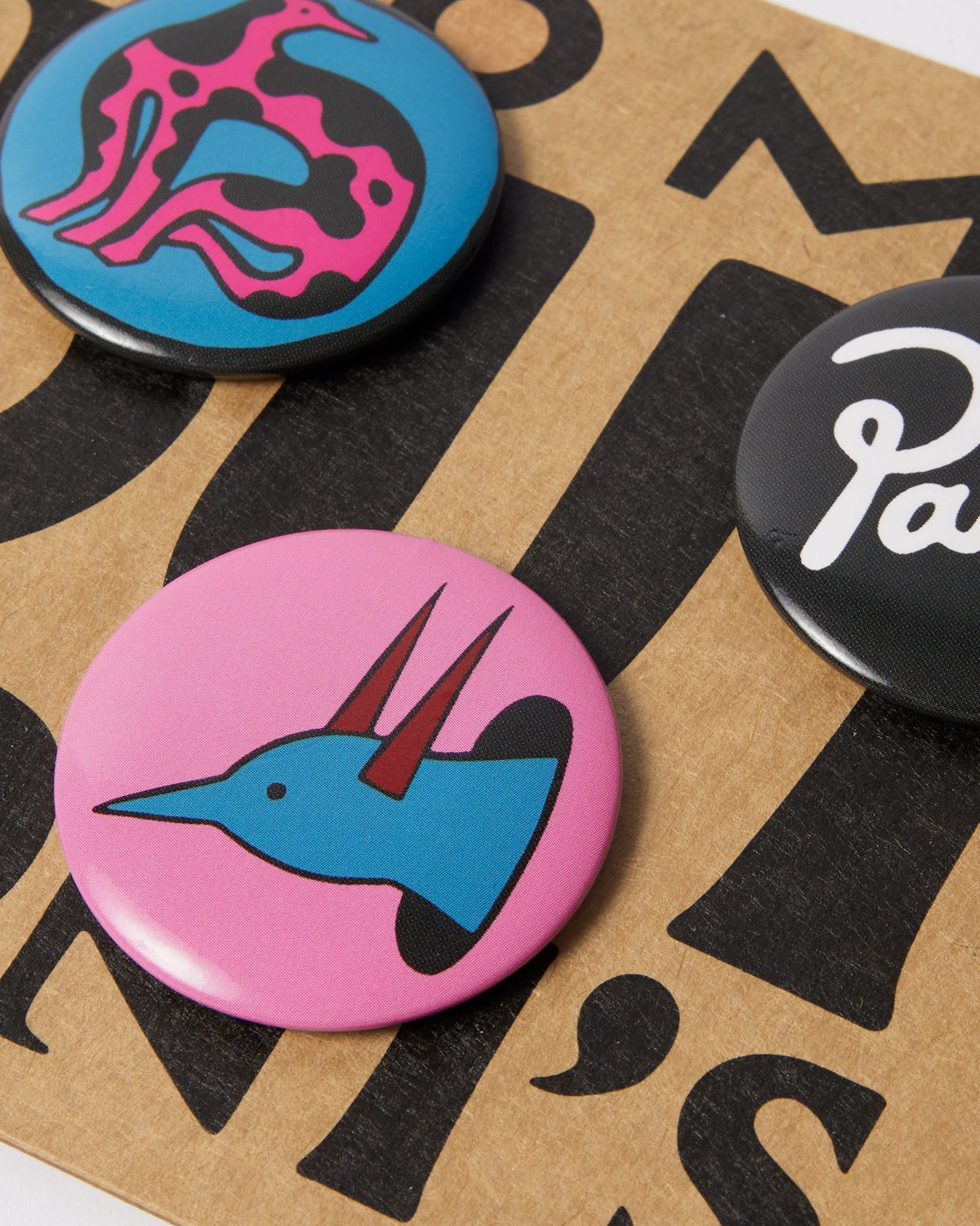 by Parra Some Butonis Pin-Back Set - Pink, close-up of the buttons on the backing card
