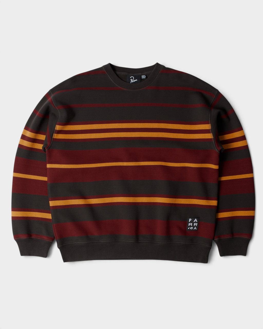 by Parra Sweatstriped Crewneck Sweatshirt - Brown, front flat-lay with red and yellow stripes on brown and a Parra label at the hem