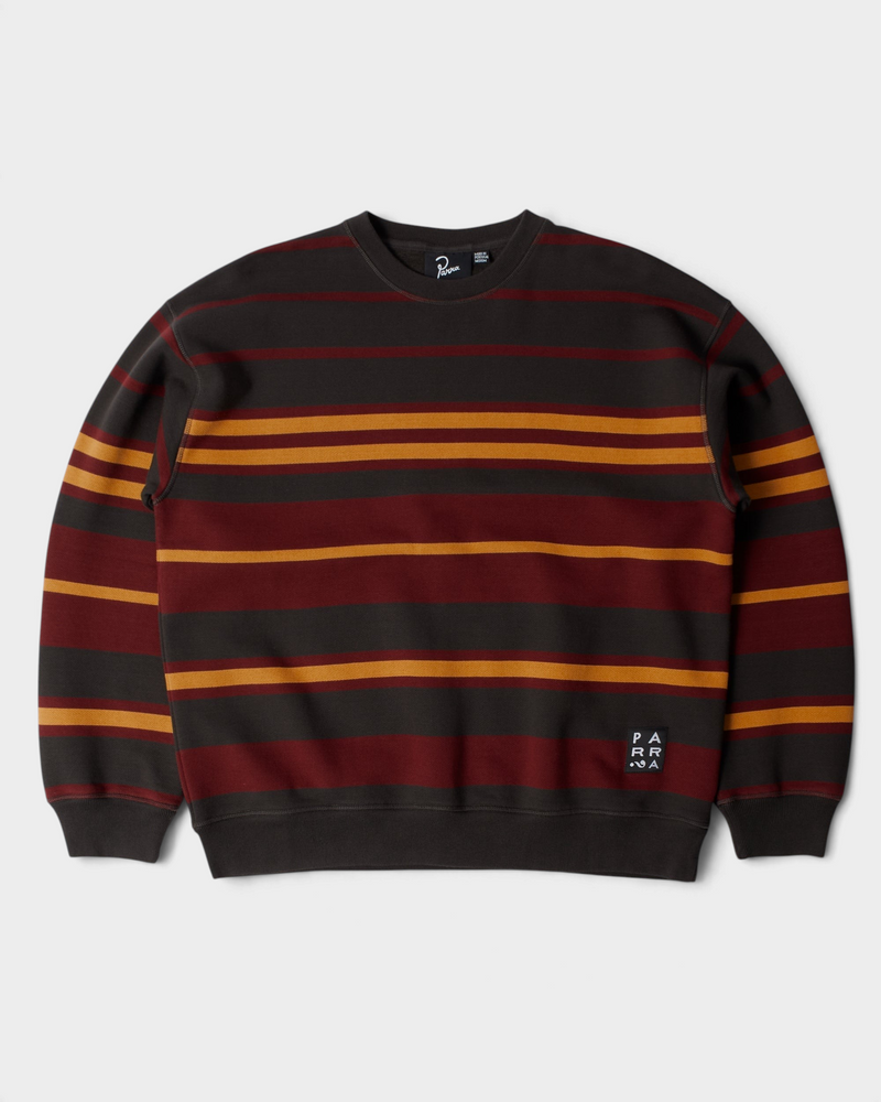 by Parra Sweatstriped Crewneck Sweatshirt - Brown, front flat-lay with red and yellow stripes on brown and a Parra label at the hem