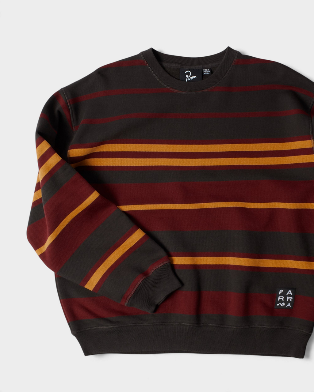 by Parra Sweatstriped Crewneck Sweatshirt - Brown, angled view of the front
