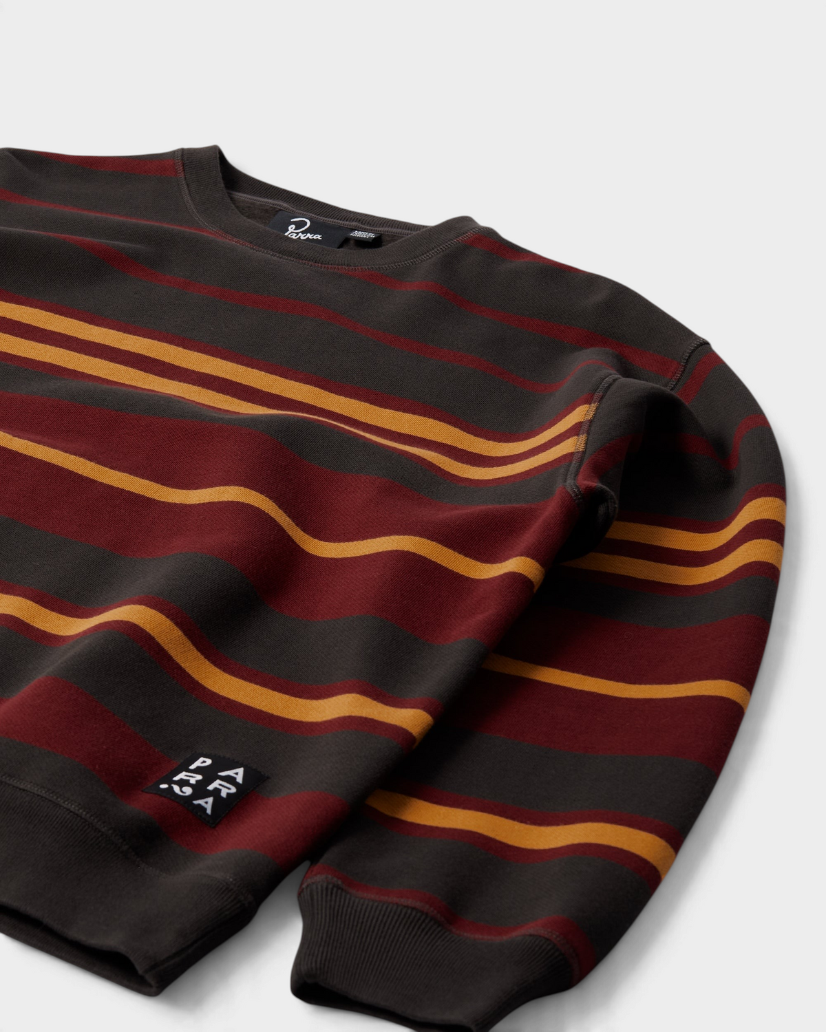 by Parra Sweatstriped Crewneck Sweatshirt - Brown, angled view of the stripes