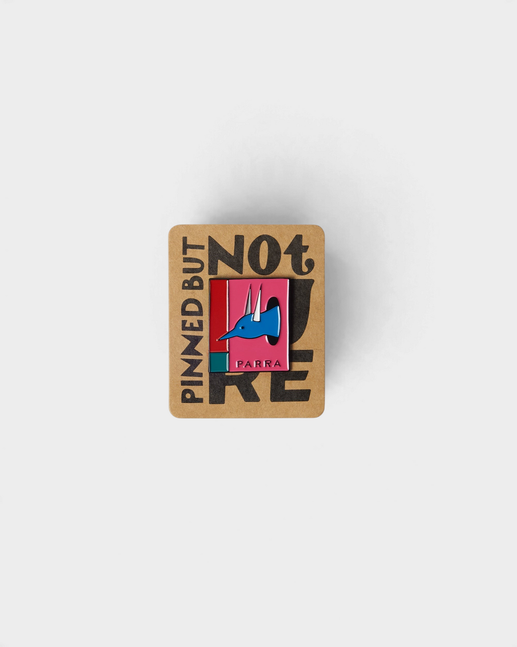 by Parra The Hunted Enamel Pin - Pink, the pin on its Pinned But Not Here backing card