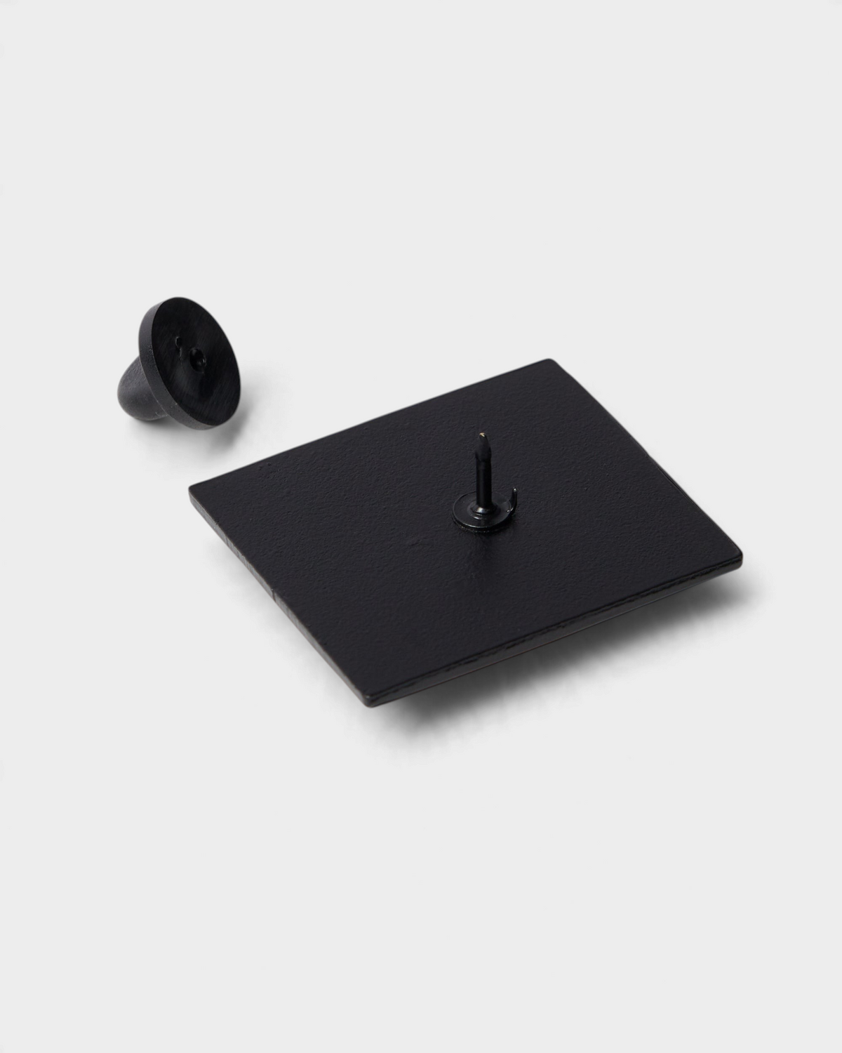 by Parra The Hunted Enamel Pin - Pink, the black back of the pin with its rubber clutch