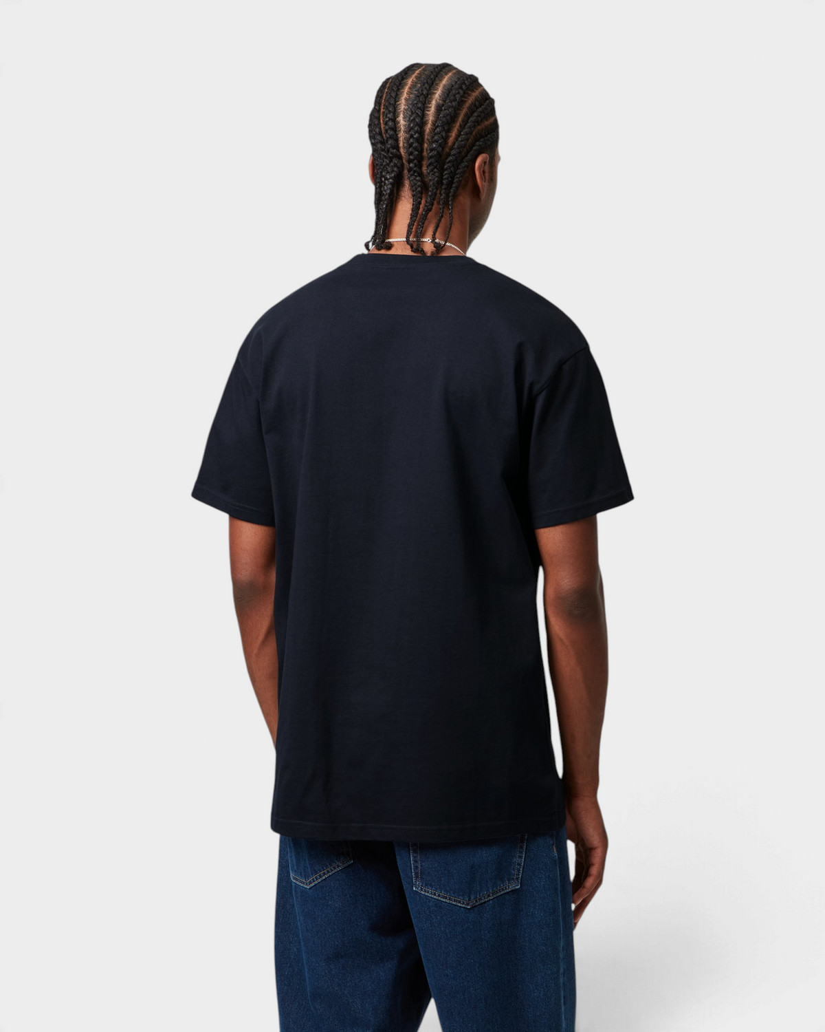 Carhartt Chase T-Shirt - Dark Navy/Gold, worn by a model