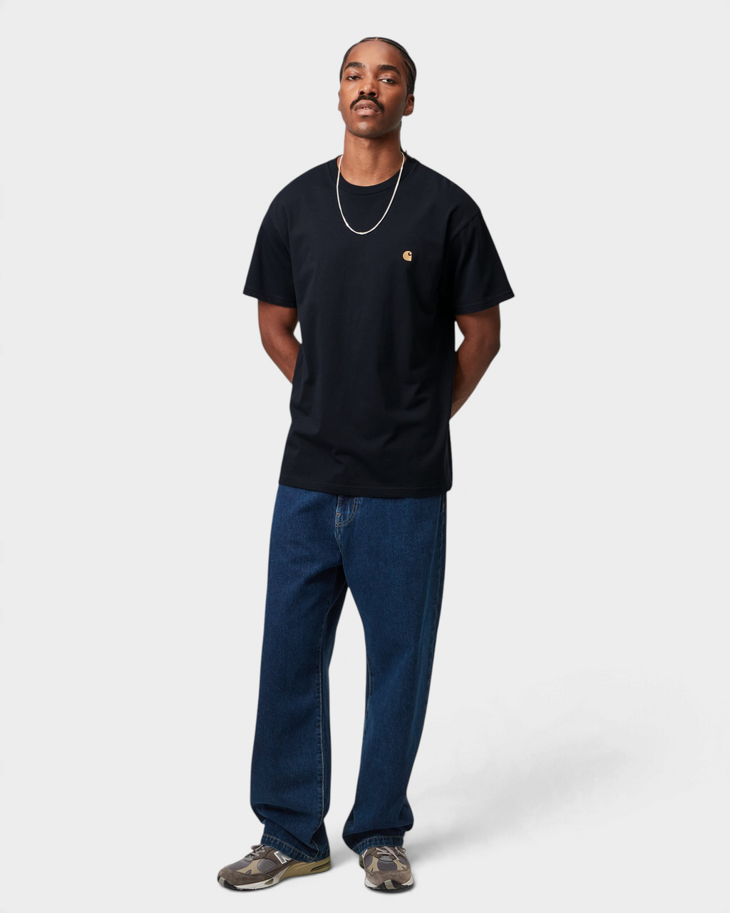 Carhartt Chase T-Shirt - Dark Navy/Gold, worn by a model