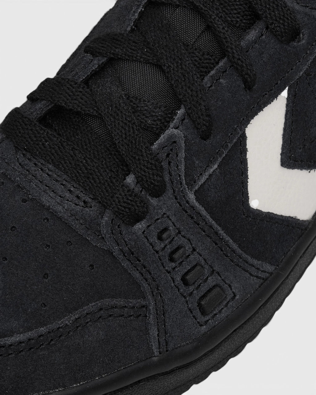 Lockwood Avenue Converse CONS AS-1 Pro Suede Shoes close up, black suede and laces with perforated panel detail beside the vintage white chevron