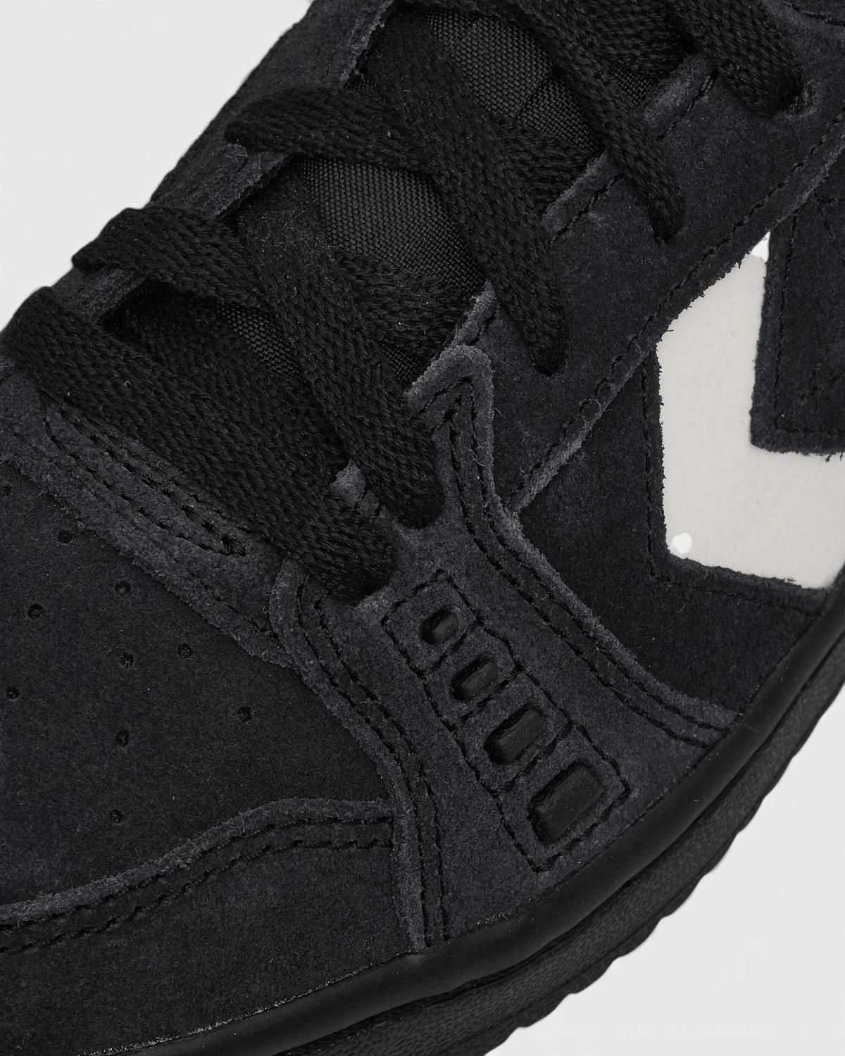 Lockwood Avenue Converse CONS AS-1 Pro Suede Shoes close up, black suede and laces with perforated panel detail beside the vintage white chevron