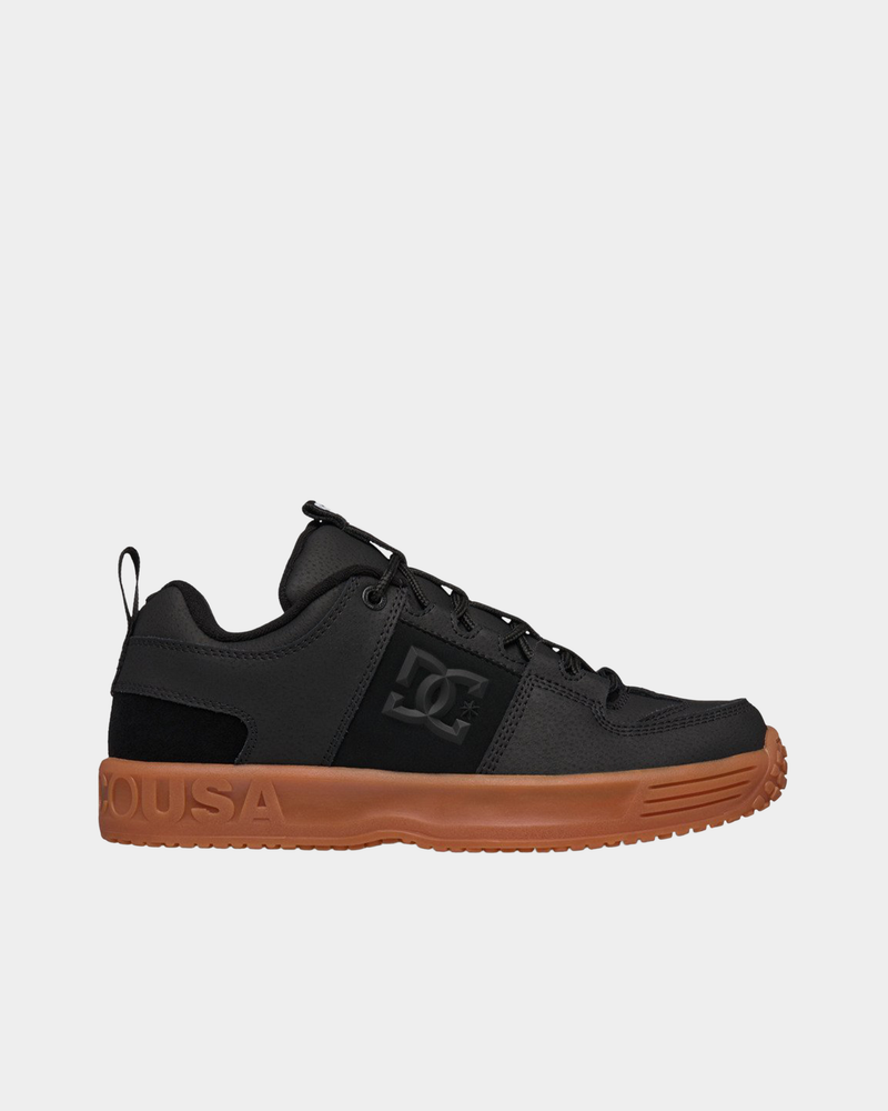 DC Lynx OG skate shoe in black leather and suede, side profile with a black DC logo panel and a gum cupsole moulded with DCUSA