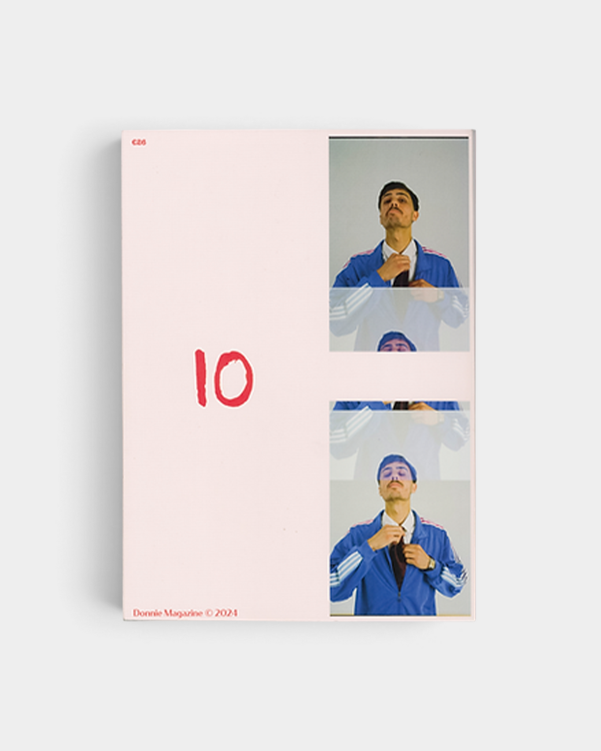 Lockwood Avenue Donnie Magazine Issue 3 open at a spread with a hand-drawn red 10 and a strip of film frames of a man in a blue track jacket adjusting his tie