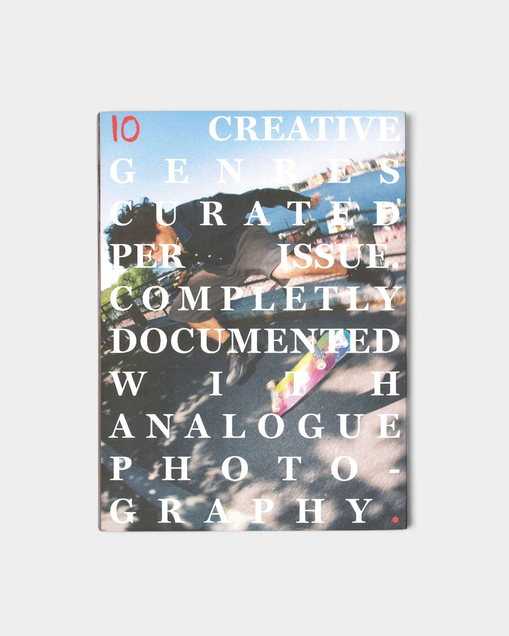 Lockwood Avenue Donnie Magazine Issue 5 cover, white serif lettering over a skater mid-air on a quayside, reading 10 creative genres curated per issue, completely documented with analogue photography