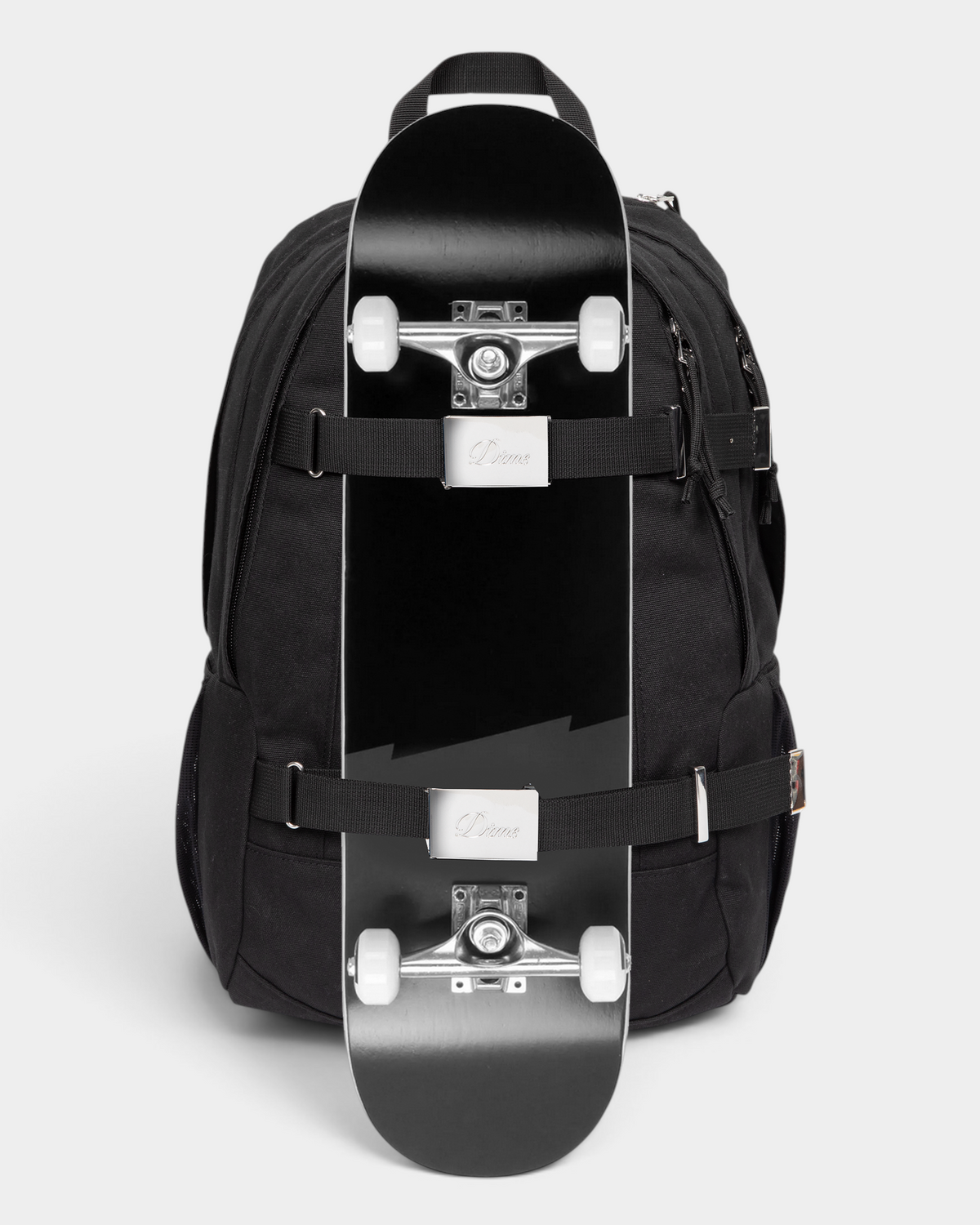 Eastpak x Dime Getter Backpack in Dime Black with a skateboard strapped to the front under both webbing straps, showing how the board carry works