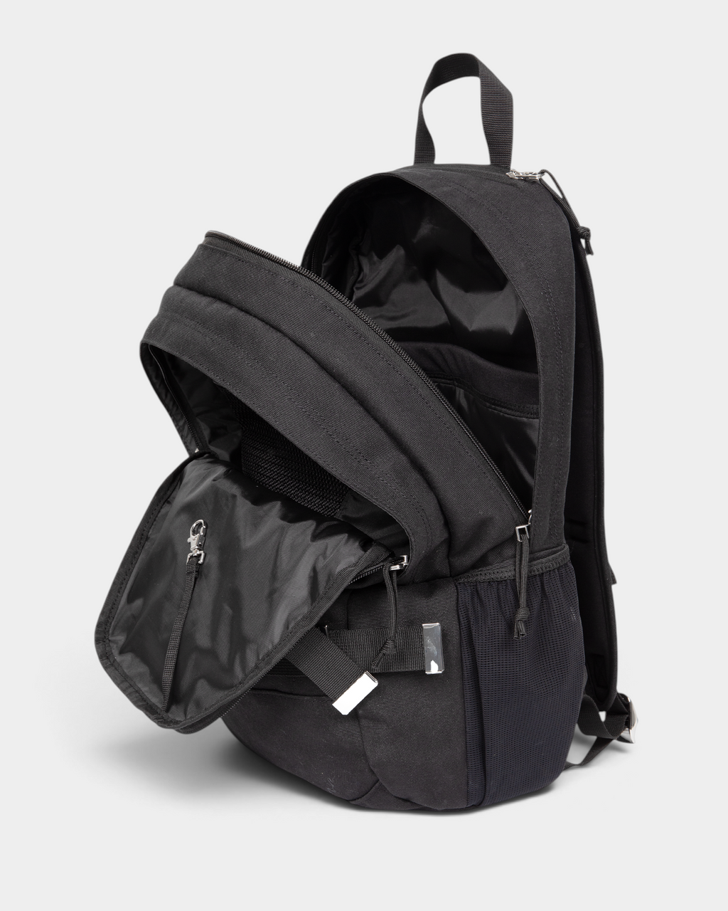 Eastpak x Dime Getter Backpack in Dime Black unzipped and open, showing the lined main compartment and the front organiser pocket