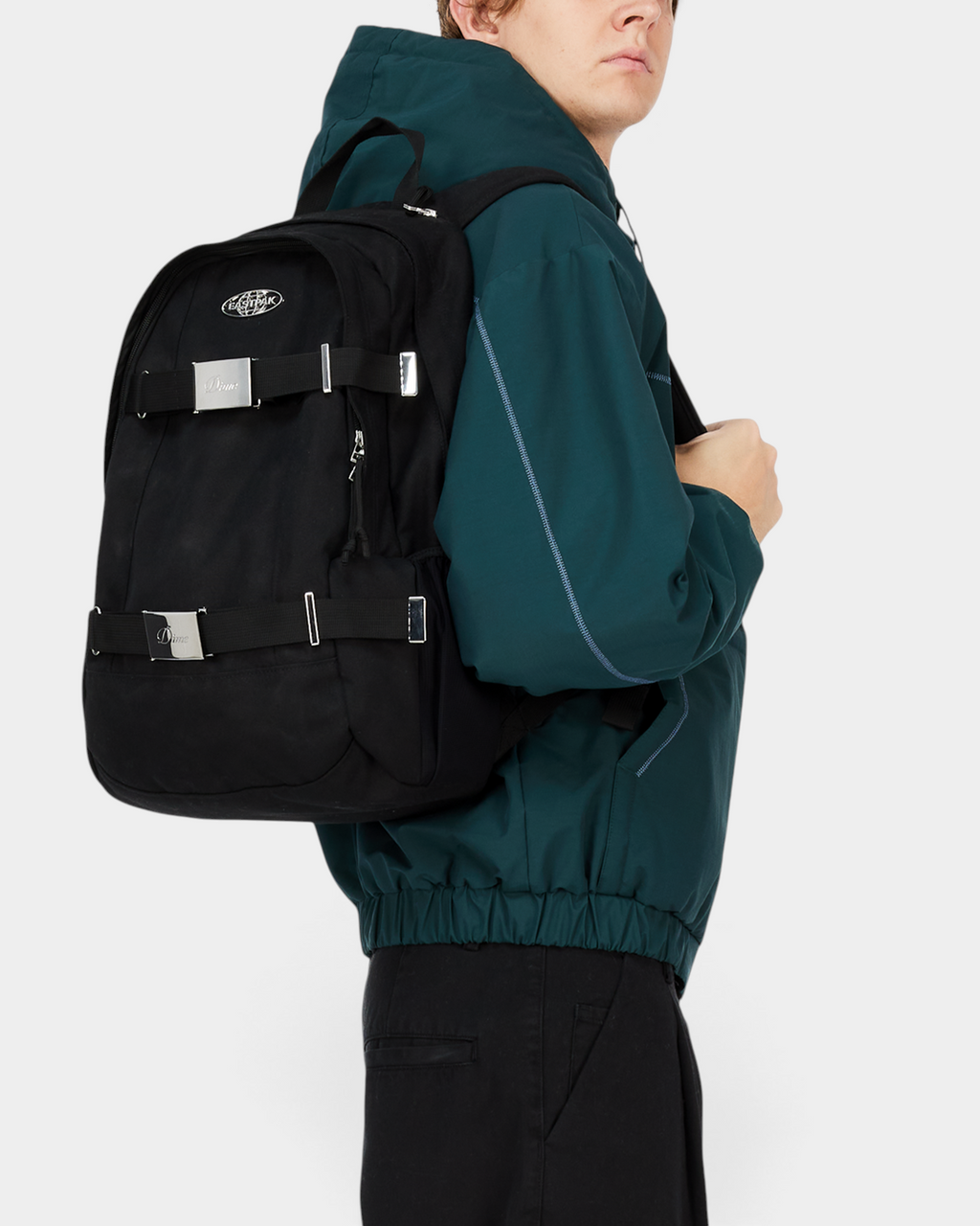 Eastpak x Dime Getter Backpack in Dime Black worn on the back, seen from the side