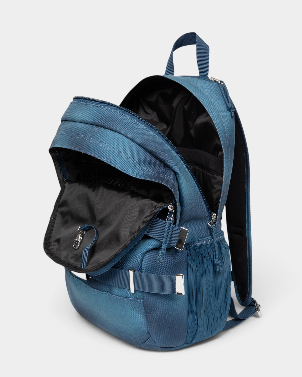 Eastpak x Dime Getter Backpack in Dime Navy unzipped and open, showing the lined main compartment and the front organiser pocket