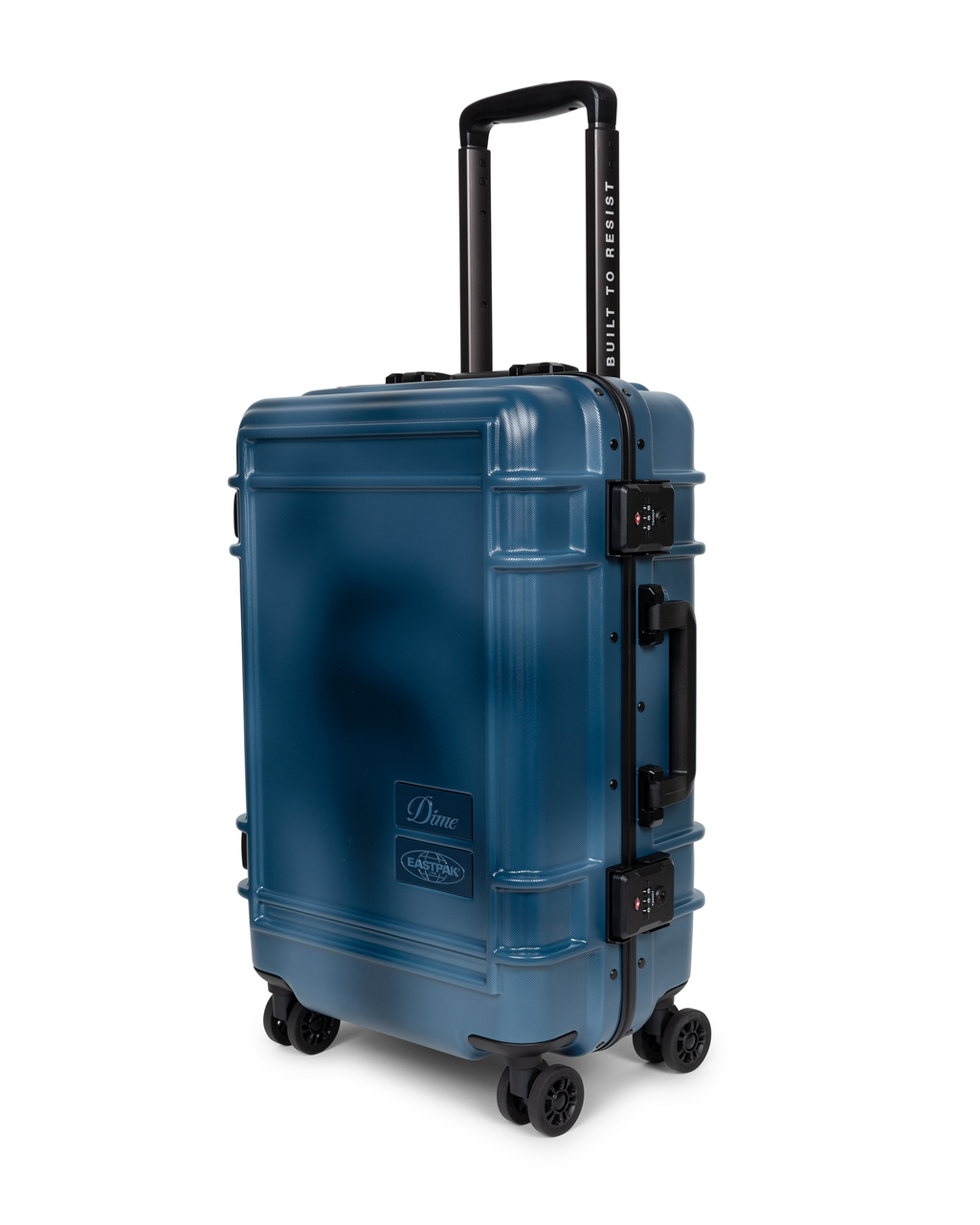 Eastpak x Dime Resist'R Case S in Dime Navy seen from the front three-quarter angle, showing the black aluminium frame edge, two TSA combination locks and the side grab handle, with BUILT TO RESIST printed up the handle stem