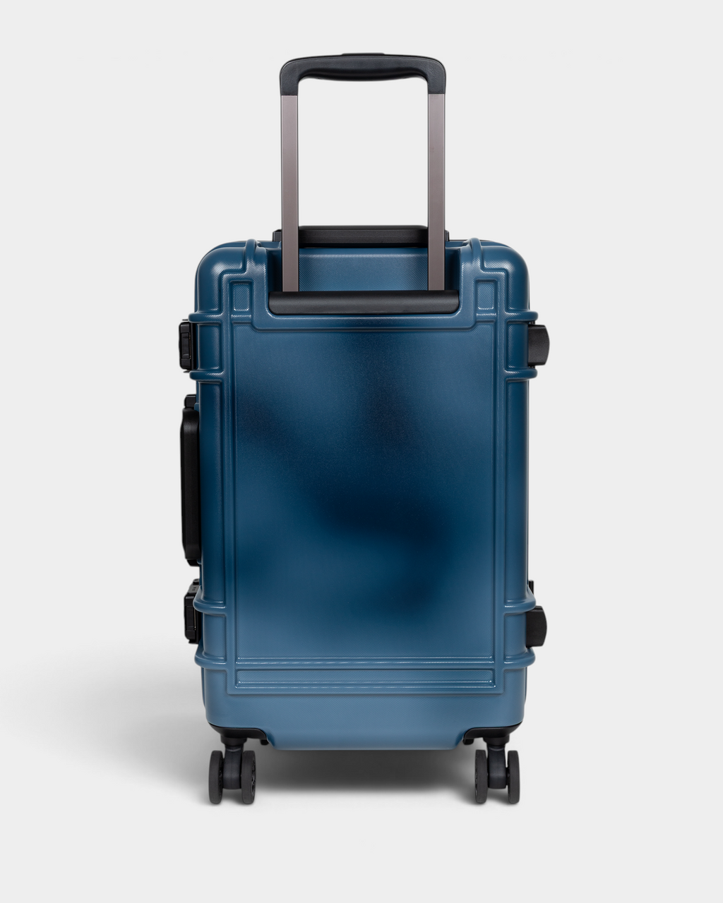Eastpak x Dime Resist'R Case S in Dime Navy, back view showing the plain navy shell, the twin telescopic handle stems and the sprayed fade that runs lighter through the panel