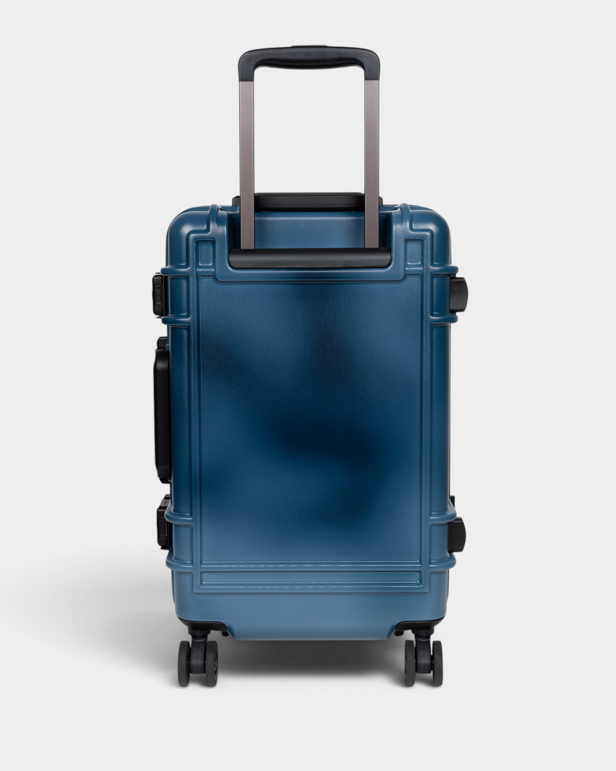 Eastpak x Dime Resist'R Case S in Dime Navy, back view showing the plain navy shell, the twin telescopic handle stems and the sprayed fade that runs lighter through the panel