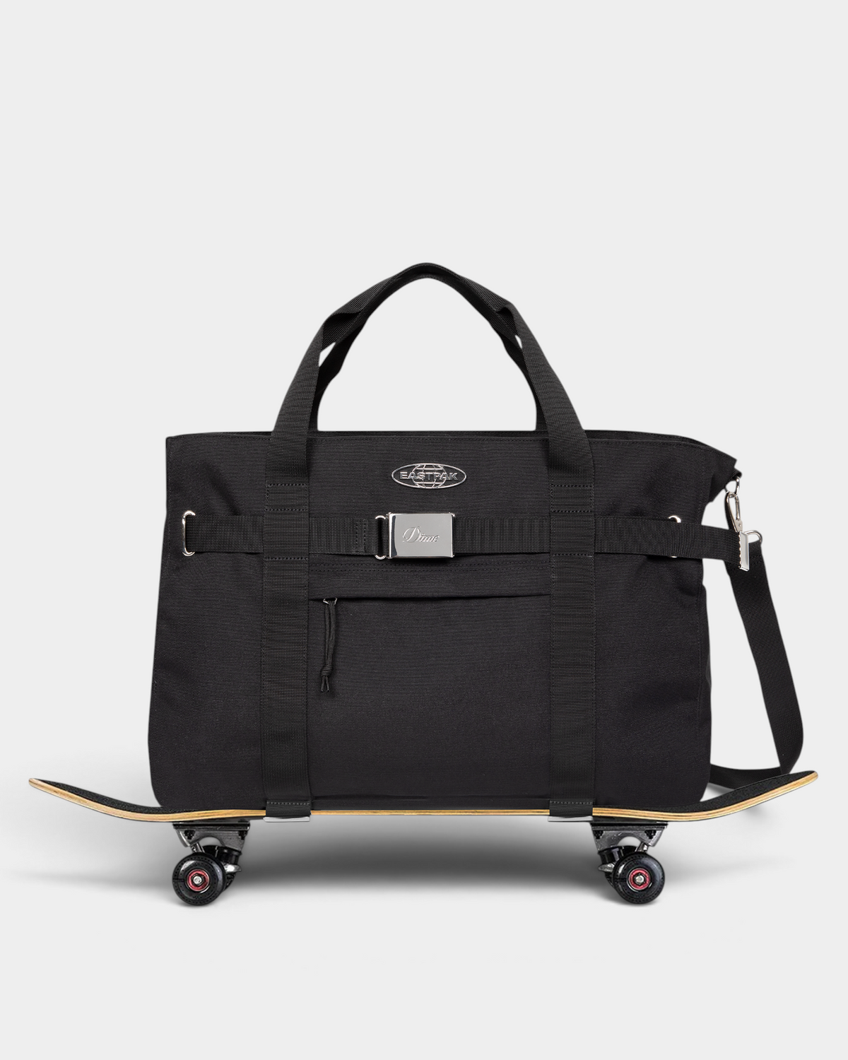 Eastpak x Dime Skate Tote in Dime Black sitting on a complete skateboard, held by the two webbing straps under the base of the bag