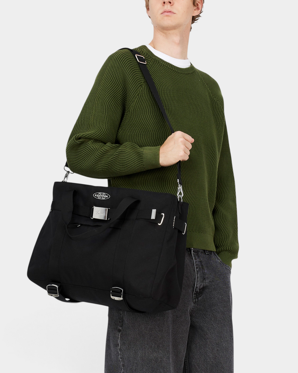 Eastpak x Dime Skate Tote in Dime Black worn crossbody on the detachable shoulder strap