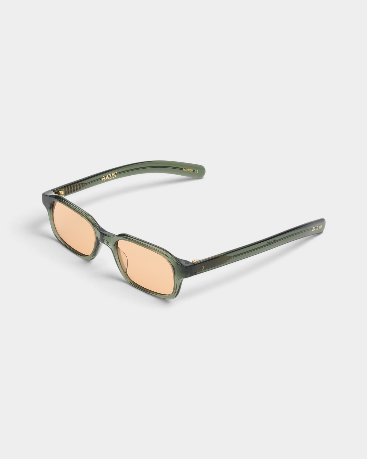 Flatlist Hanky sunglasses in crystal duck green, angled three-quarter view with the temples open and the faded orange lenses