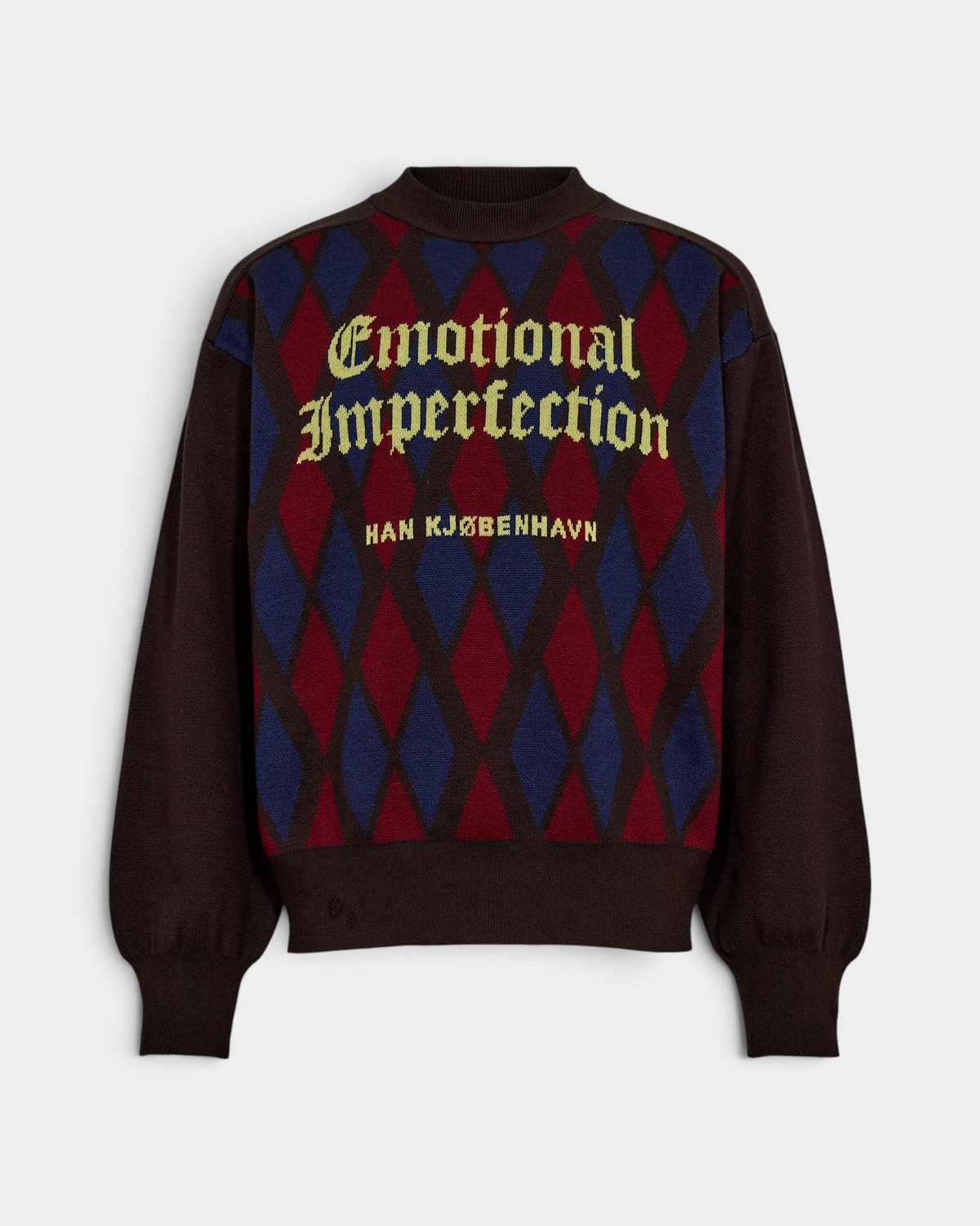 Han Kjøbenhavn Checked Knit Sweater in Brown laid flat from the front, showing a red and blue diamond jacquard panel carrying Emotional Imperfection and HAN KJØBENHAVN in gold gothic lettering, with plain brown shoulders and sleeves and a ribbed stand collar