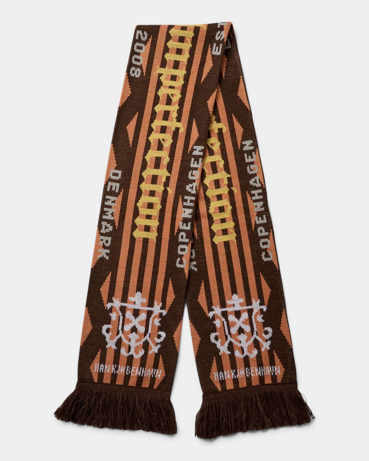 Han Kjøbenhavn Club Scarf in Dark Brown laid flat and folded at the middle, showing orange jacquard panels over a dark brown ground with COPENHAGEN and DENMARK lettering, twin crests and brown fringe tassels at both ends