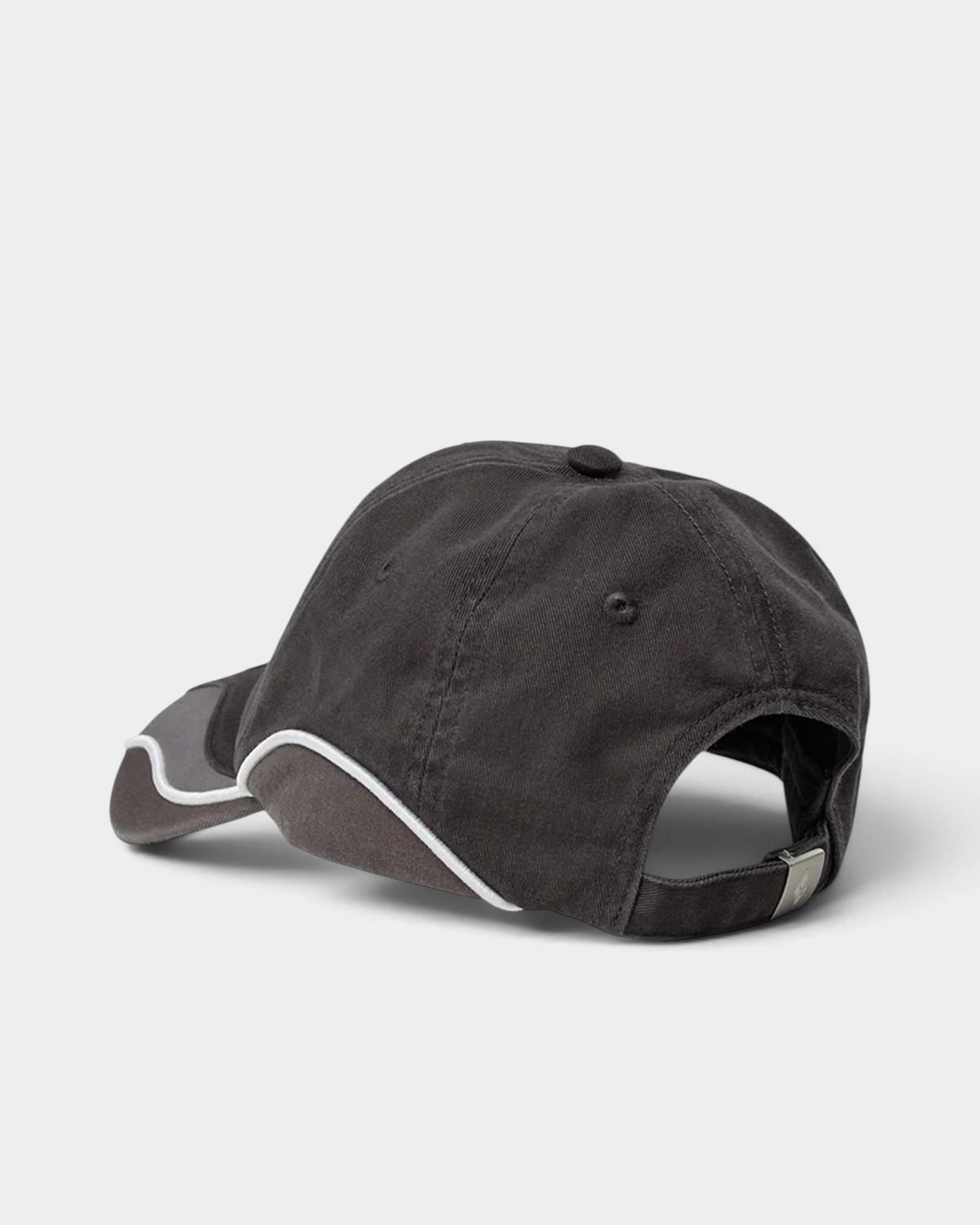 Han Kjøbenhavn Retro Cap in Stone Grey from the back, showing the buckle clasp strap with the engraved diamond logo and the open rear panel