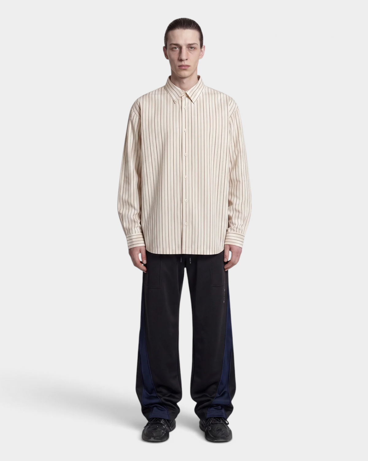 Han Kjøbenhavn Striped Casual Shirt in Off White worn over dark trousers, shown full length, with the relaxed dropped-shoulder line falling past the hip
