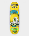 Lockwood Avenue Heroin Pickled Egg 9.38 inch skateboard deck, shown in yellow stain, with an egg character in a glass jar and green Pickled Egg lettering