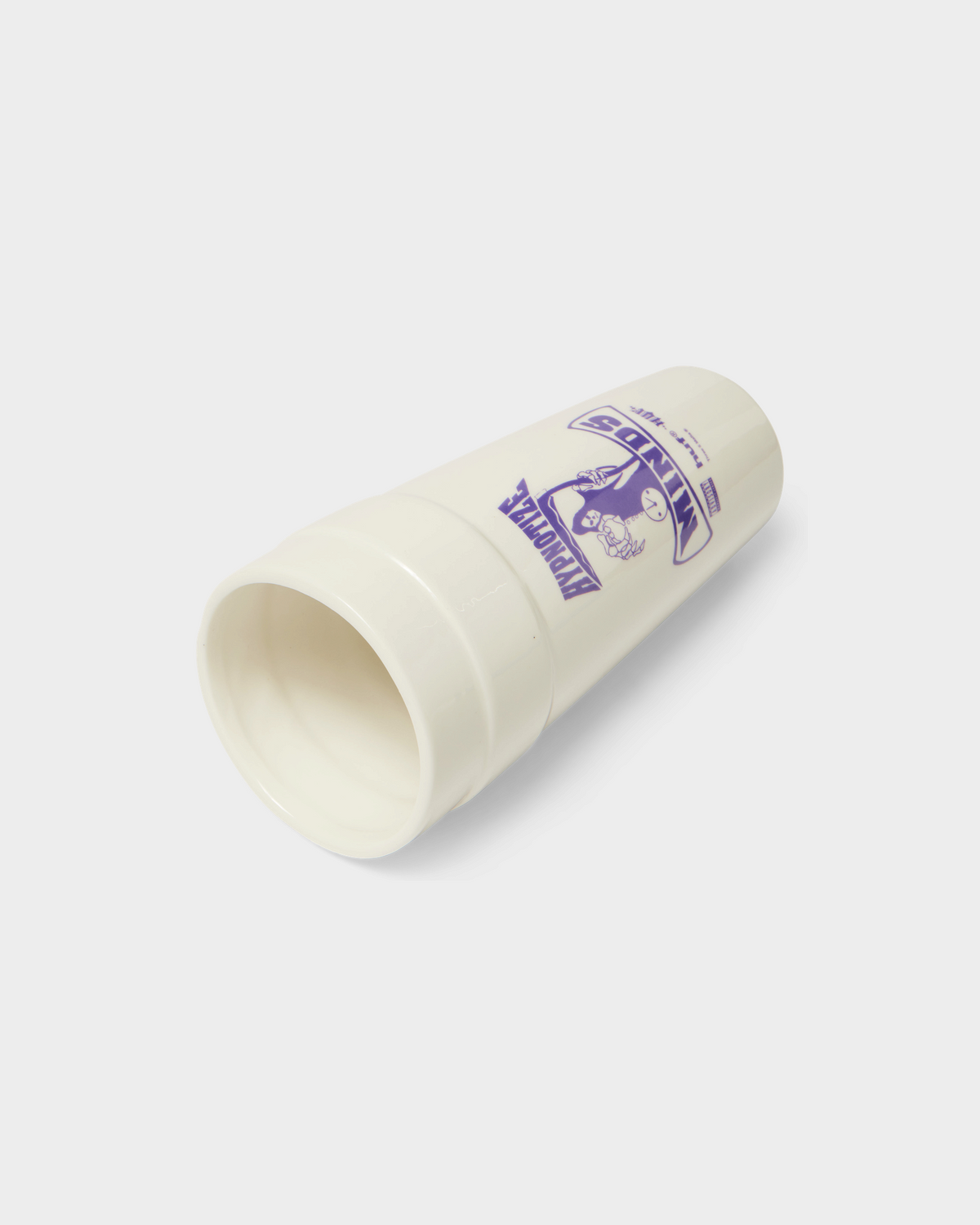 HUF x Three 6 Mafia Ceramic Double Cup - White, lying on its side, showing the opening and the print