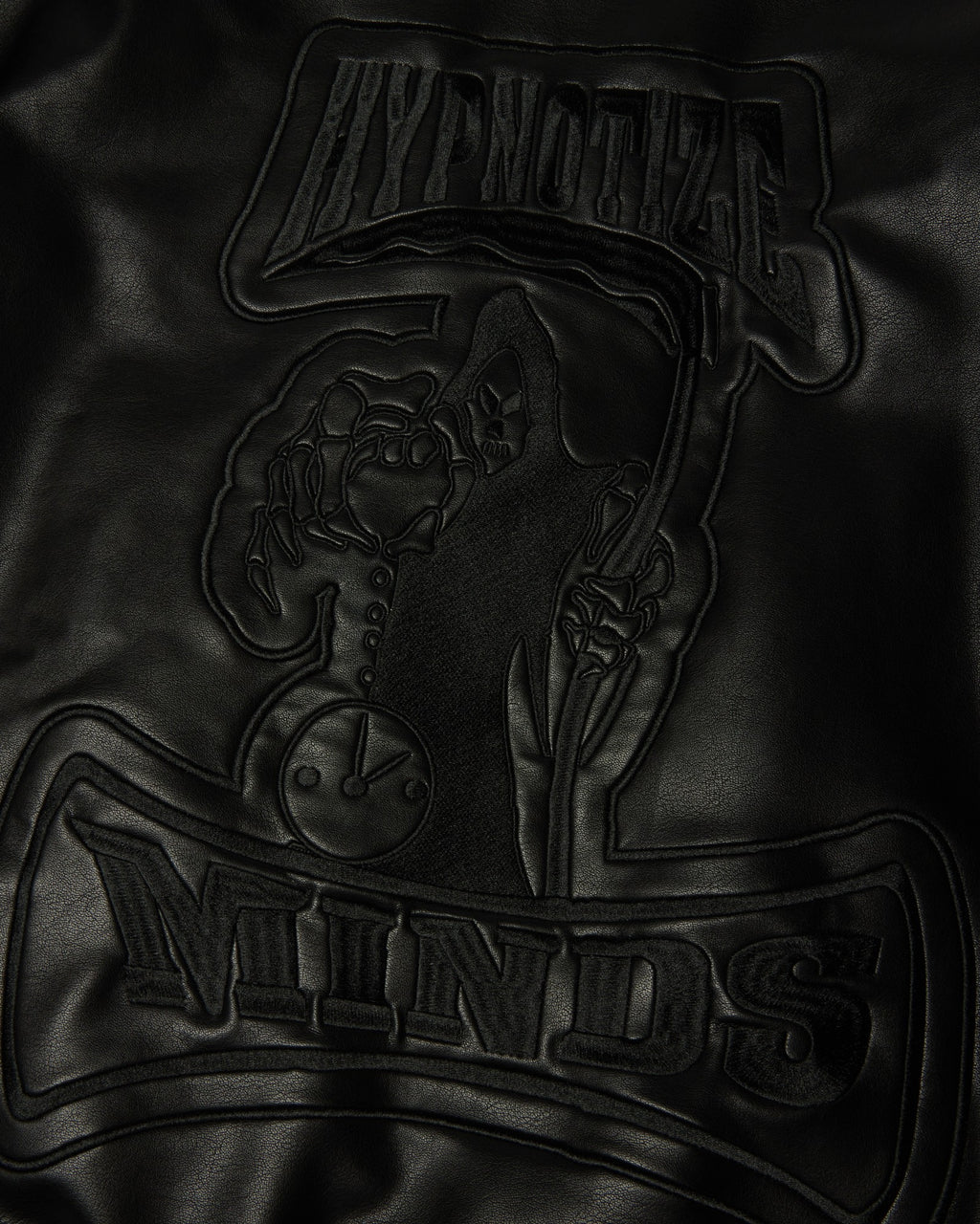 HUF x Three 6 Mafia Jacket - Black, close-up of the embossed Hypnotize Minds graphic on the back