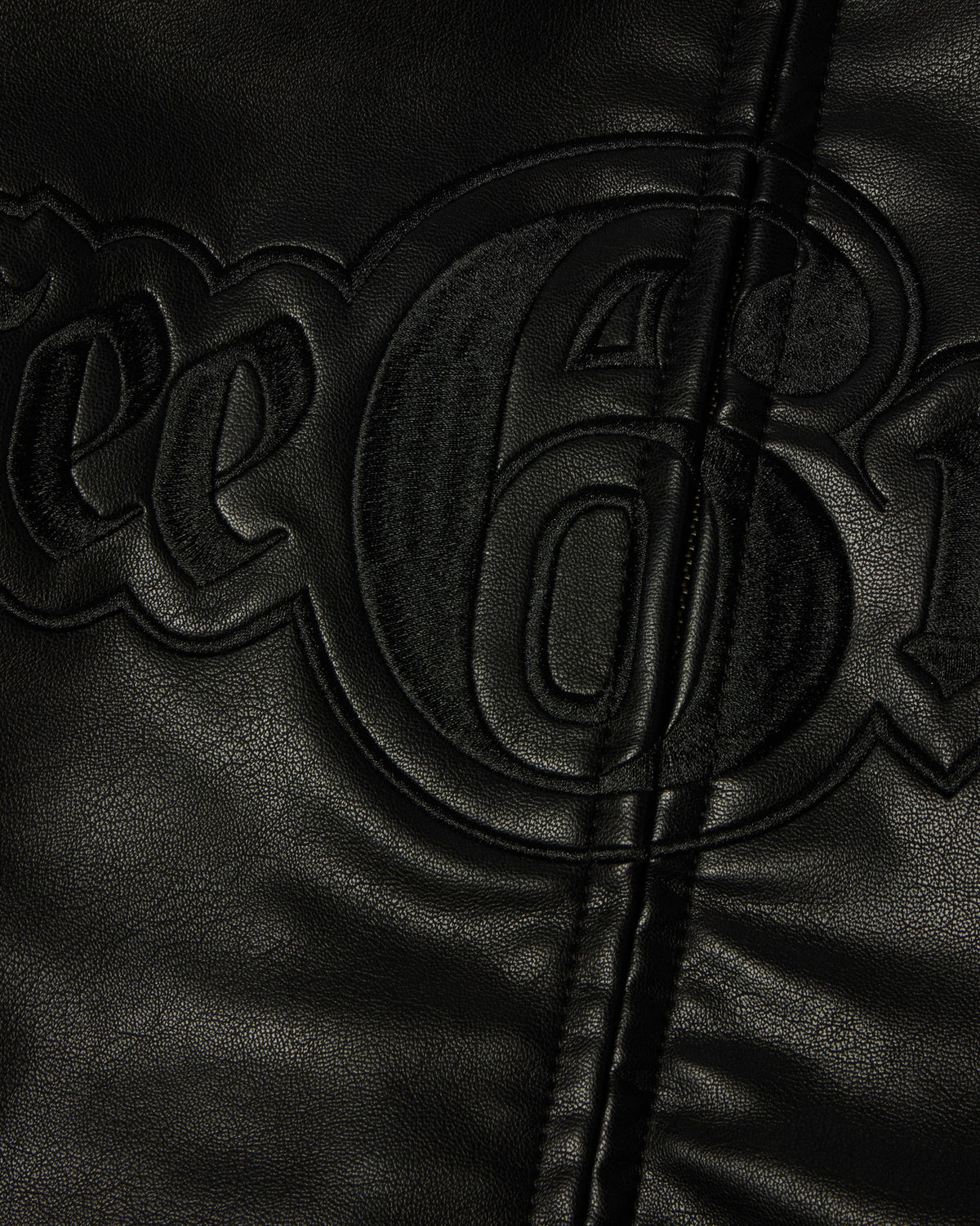 HUF x Three 6 Mafia Jacket - Black, close-up of the lettering running across the zip