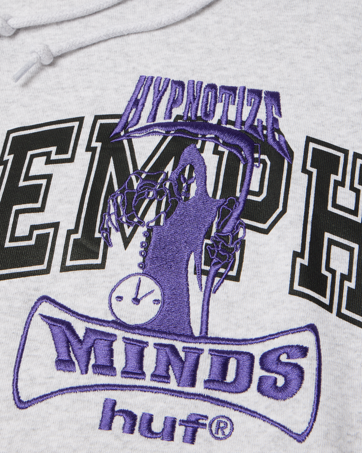 HUF x Three 6 Mafia Memphis Pullover Hoodie - Heather Grey, closer detail of the embroidered Minds logo