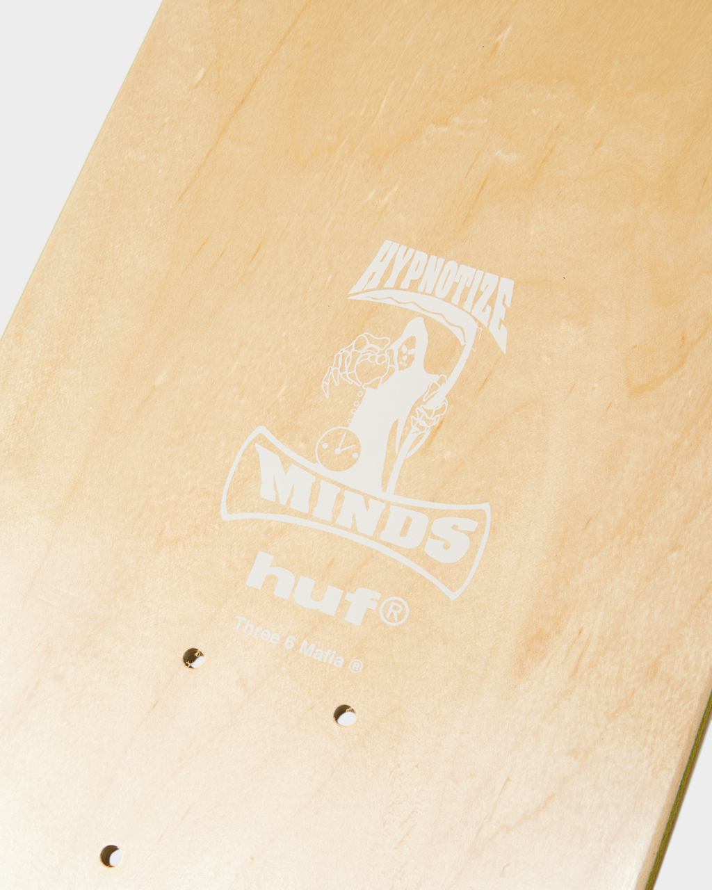 HUF x Three 6 Mafia Skate Deck 8.25" - Multi, close-up of the underside logo and the truck holes