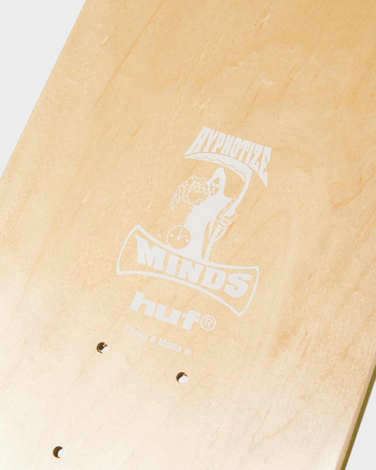 HUF x Three 6 Mafia Skate Deck 8.25" - Multi, close-up of the underside logo and the truck holes