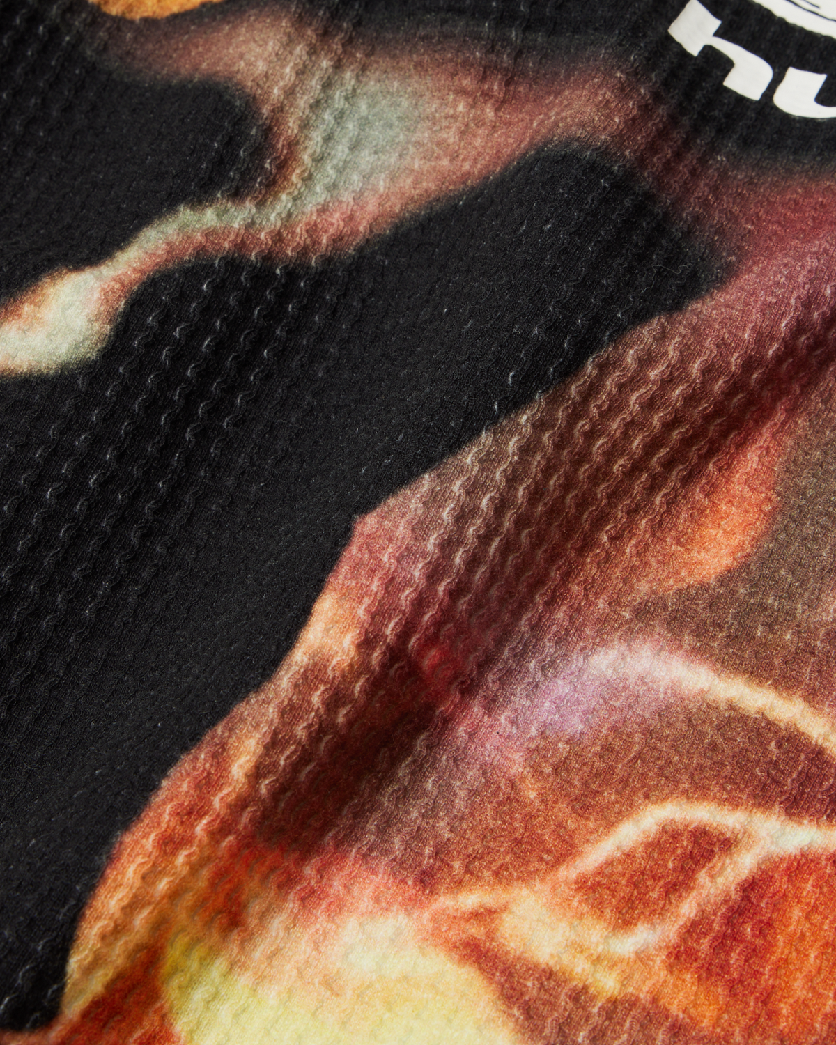 HUF x Three 6 Mafia Torched Long-Sleeve Thermal Shirt - Multi, close-up of the waffle knit and skull print
