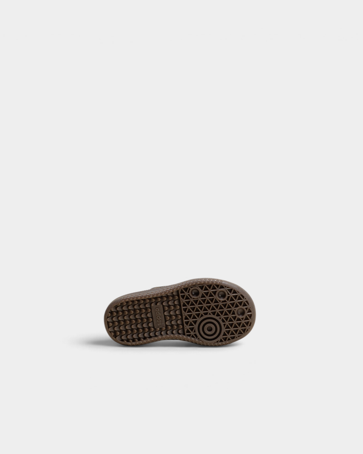 Gum rubber outsole of the adidas Kids Samba OG with its pivot-circle tread