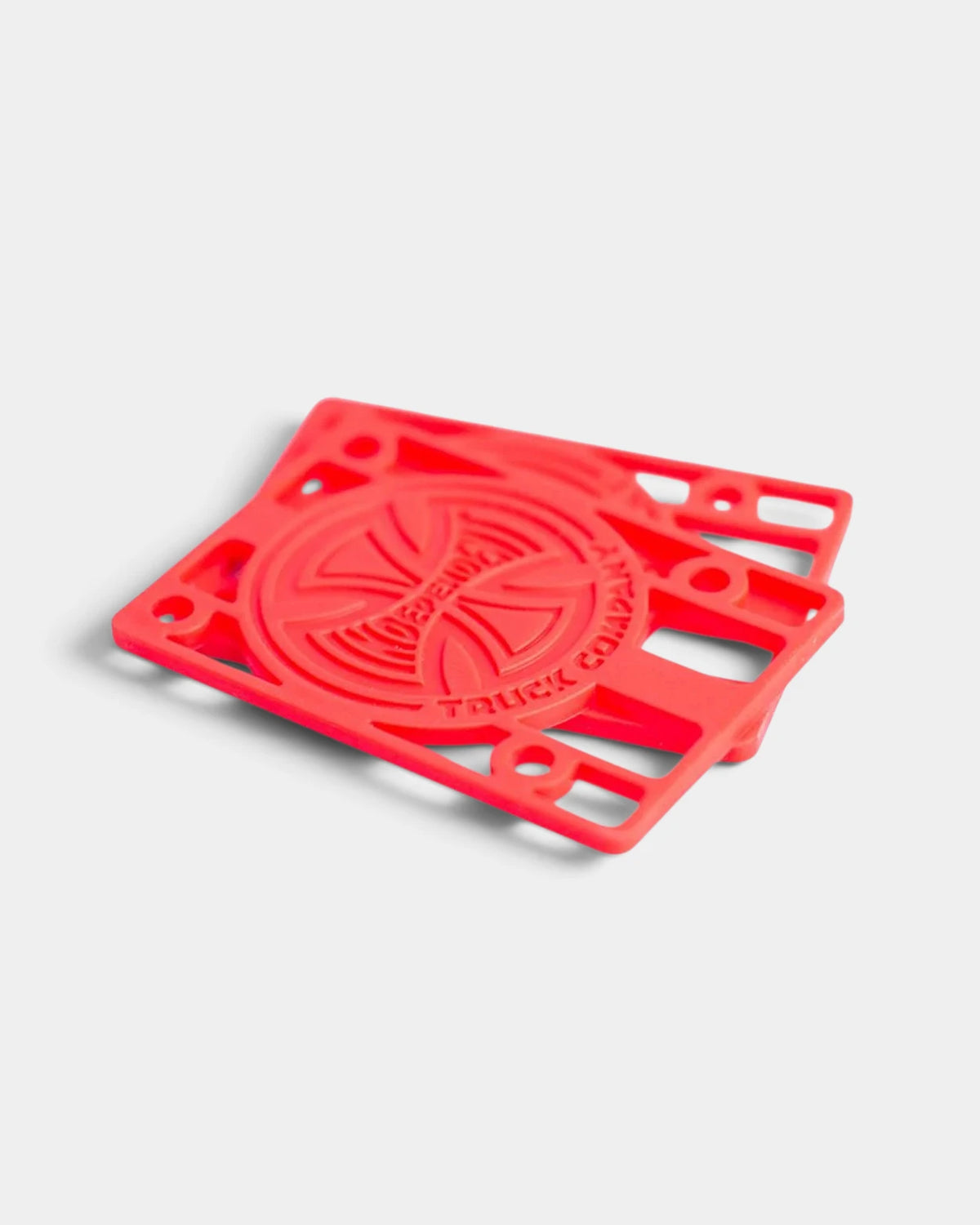 Independent 1/8 inch riser pads in red, a stacked pair with the embossed Independent Truck Company cross logo